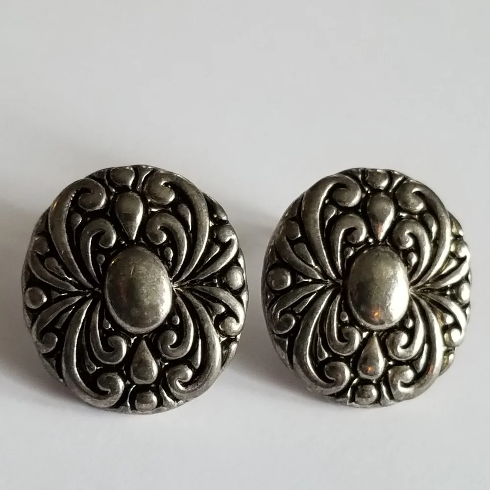 Earrings Silver tone earrings oval stud scrolled design